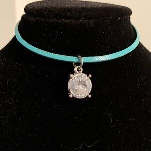 Green bangle bracelet with shiny rhinestone charm